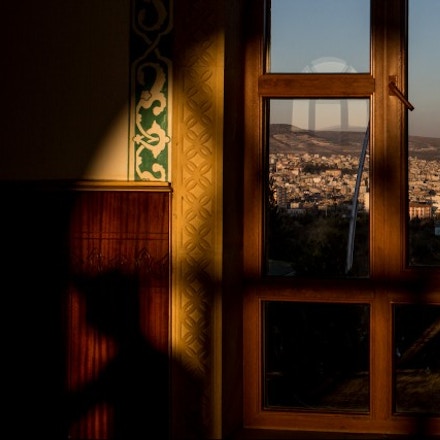 KILIS, TURKEY - MARCH 01: The town of Kilis is seen through the window of the Muhammed Bedevi Mosque on March 1, 2016 in Kilis, Turkey. Kilis a city located just 10km from the Syrian border and the location of the Oncupinar Border crossing, has been Turkey's frontline during the refugee crisis. With a population of 129,000 Kilis was recently nominated for the Nobel Peace Prize after the number of refugees living in the city equalled that of the Turkish population. How the city has integrated this number of refugees and the support given to refugees newly arrived, has not been seen in other cities around the world. The city has made considerable efforts to integrate the refugees by allowing them to work, rent apartments and open businesses such as cafe's and Syrian restaurants, the town has seen a massive boom in construction as it builds cheap new apartment blocks in an attempt to provide affordable housing for the refugees allowing them to have a standard of living similar to what they had in Syria.  (Photo by Chris McGrath/Getty Images)