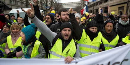 Gilet Jaune protesters chant slogans while marching in Paris, France, January 12, 2018. Joe Penney for The Intercept