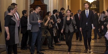 WASHINGTON, DC - JANUARY 24: Rep. Alexandria Ocasio-Cortez (D-NY) walks to the Senate Chamber on Capitol Hill, January 24, 2019 at the U.S. Capitol in Washington, DC. The Senate has failed to pass two procedural votes, one proposed by Republicans and the other proposed by the Democrats, to re-open the government.(Photo by Zach Gibson/Getty Images)