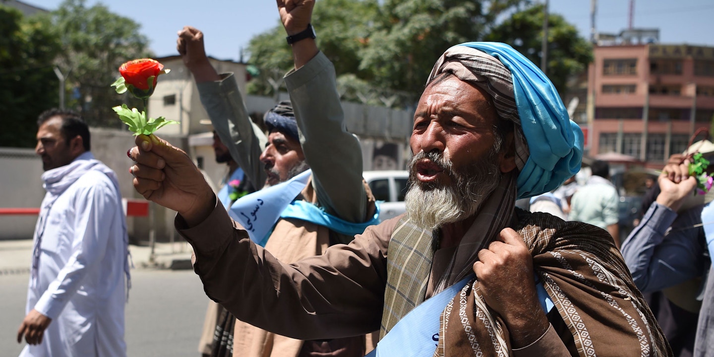 An Afghan peace activist shouts slogans in demand to an end to the war during a march from Helmand as he arrives in Kabul on June 18, 2018. - Dozens of peace protesters arrived in Kabul on June 18 after walking hundreds of kilometres across war-battered Afghanistan, as the Taliban ended an unprecedented ceasefire and resumed attacks in parts of the country. (Photo by WAKIL KOHSAR / AFP) (Photo credit should read WAKIL KOHSAR/AFP/Getty Images)