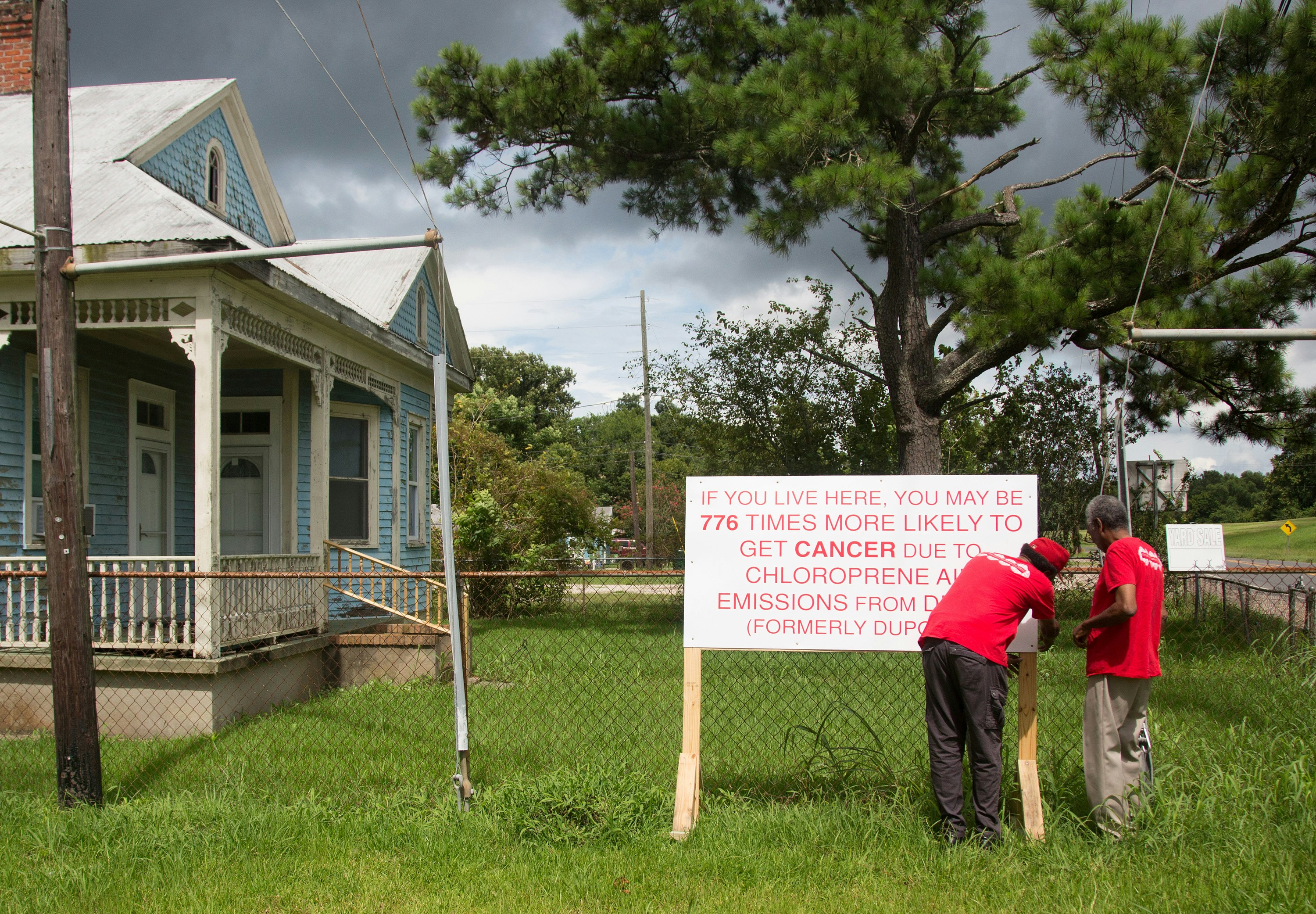 Concerned Citizens of St Jophn the Baptist puting up signs in Reserve, Louisiana. July 16, 2017