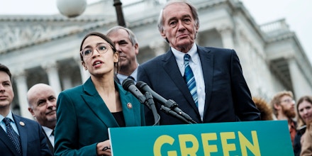 Rep. Alexandria Ocasio-Cortez (D-N.Y.) speaks alongside Sen. Ed Markey (D-Mass.) at a news conference about the Green New Deal, in Washington, Feb. 7, 2019. The measure, drafted by Ocasio-Cortez and Markey, calls for a sweeping environmental and economic mobilization that would make the United States carbon neutral by 2030. (Pete Marovich/The New York Times)