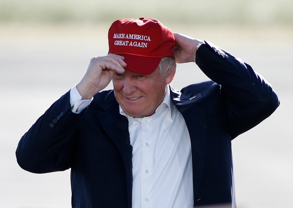 FILE - In this June 1, 2016, file photo, then Republican presidential candidate Donald Trump wears his "Make America Great Again" hat at a rally in Sacramento, Calif. Outside groups are promising to spend millions of dollars boosting President Donald Trump's agenda. This week, Making America Great began spending more than $1 million on an ad that will air in 10 states with Democratic senators. (AP Photo/Jae C. Hong, File)