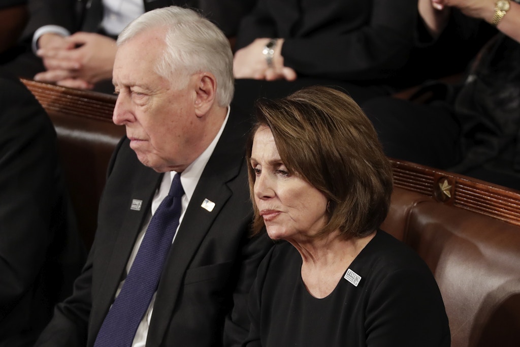 House Minority Leader Nancy Pelosi of California and Minority Whip Steny Hoyer, D-Md., listen to the State of the Union address to a joint session of Congress on Capitol Hill in Washington, Tuesday, Jan. 30, 2018. (AP Photo/J. Scott Applewhite)