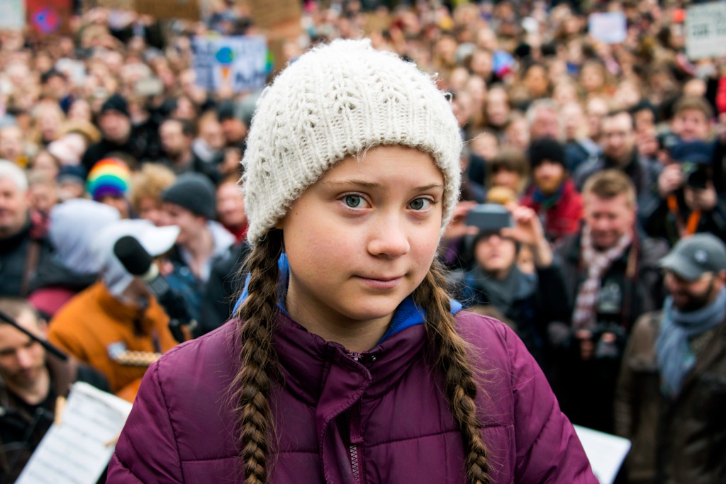 01 March 2019, Hamburg: Greta Thunberg, climate activist, stands on a stage during a rally at the town hall market. The young Swedish woman has come to Germany for the first time for a school strike for more climate protection. Photo by: Daniel Bockwoldt/picture-alliance/dpa/AP Images