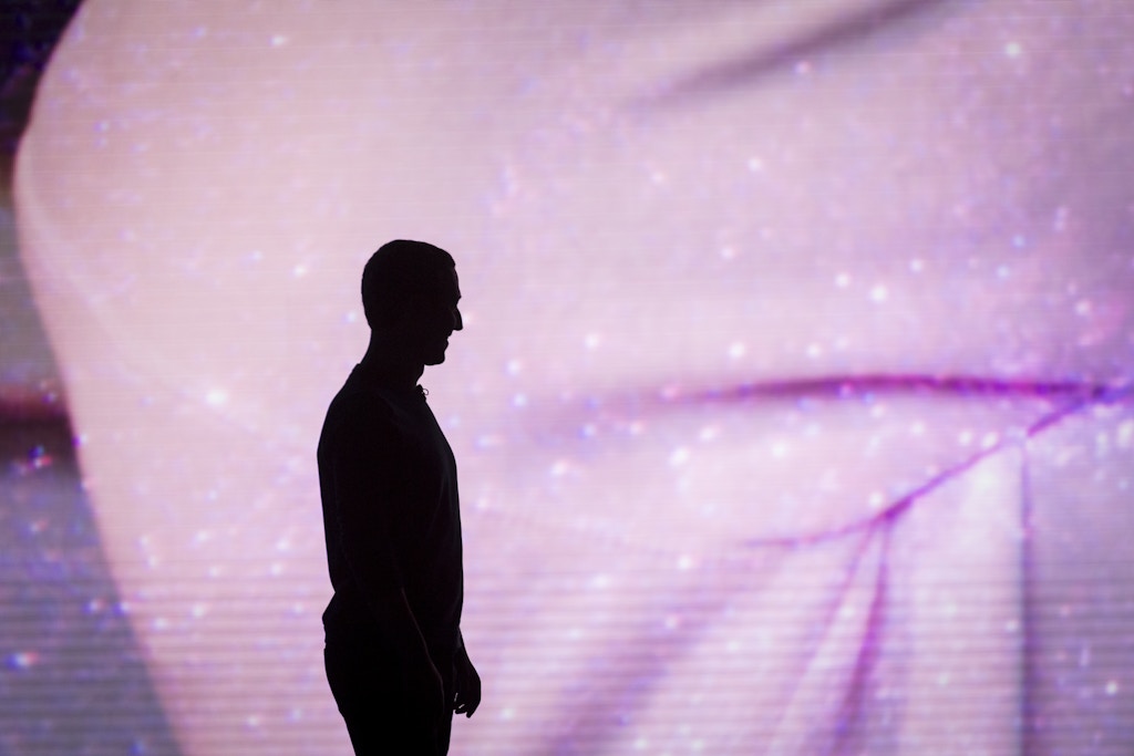 The silhouette of Mark Zuckerberg, chief executive officer and co-founder of Facebook Inc., watches a demonstration during the Oculus Connect 5 product launch event in San Jose, California, U.S., on Wednesday, Sept. 26, 2018. Facebook unveiled a wireless virtual-reality headset called Oculus Quest, an attempt to help popularize the developing technology with a more mainstream audience. Photographer: David Paul Morris/Bloomberg via Getty Images