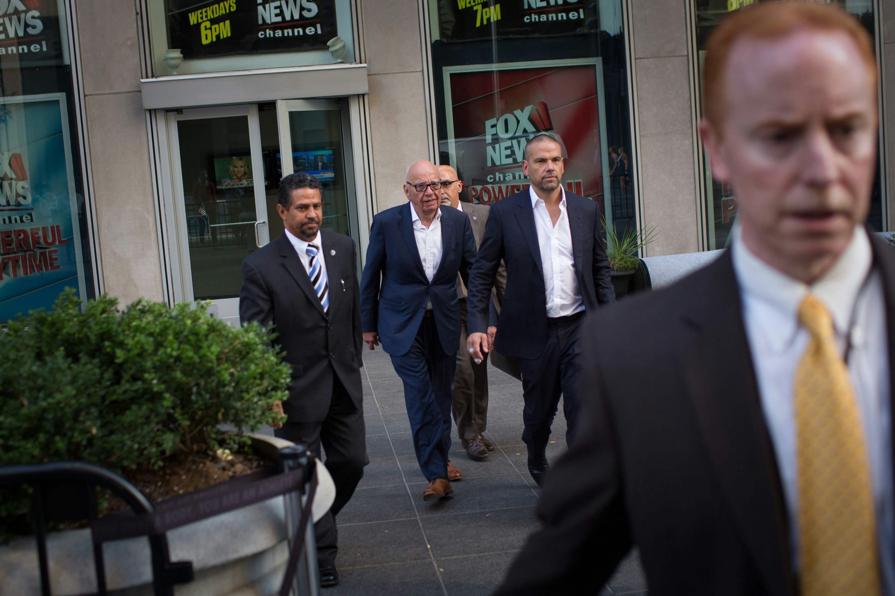 NEW YORK, NY - JULY 21: Rupert Murdoch (C) leaves the News Corporation building with his son Lachlan Murdoch (2-R) on July 21, 2016 in New York City. Rupert Murdoch is taking over as Chairman and CEO of Fox News Channel after former Chairman and CEO Roger Ailes departed the company today amid sexual harassment charges. (Photo by Kevin Hagen/Getty Images)