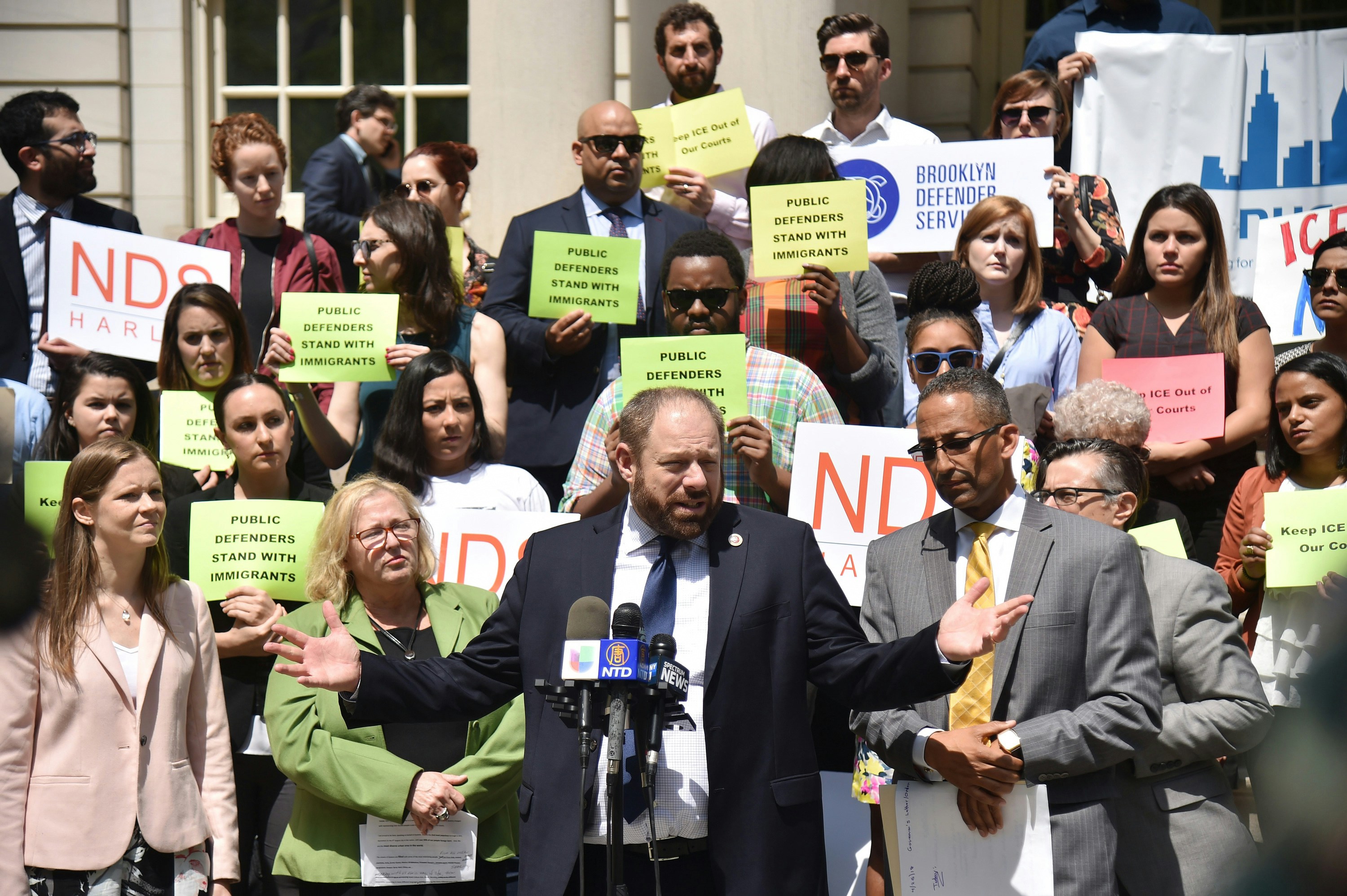 New York City council member Rory Lancman surounded by public defenders and advocates give a press conference to demand to the Chief judge DiFiore to prohibit ICE arrests in all courthouses, except when authorized by a judicial warrant, in New York, on May 9, 2018. (Photo by HECTOR RETAMAL / AFP)(Photo credit should read HECTOR RETAMAL/AFP/Getty Images)