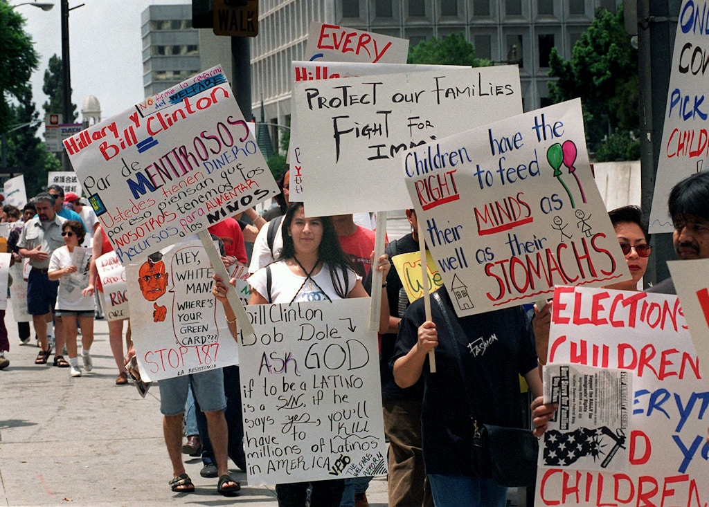 Some of an estimated 300 protesters display their feelings  during a rally outside the Federal Building in downtown Los Angeles Sunday, Aug. 4, 1996  The people were protesting  President Clinton's approval of the welfare reform bill he plans to sign. (AP Photo/Frank Wiese)