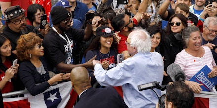 Senator Bernie Sanders, an Independent from Vermont and 2020 presidential candidate, center, greets attendees during a campaign rally in Los Angeles, California, U.S., on Saturday, March 23, 2019. No longer a fringe candidate or an outsider, Sanders will be under pressure to score decisive victories in early contests for the Democratic nomination or risk seeing his 2020 candidacy deflate. Photographer: Patrick T. Fallon/Bloomberg via Getty Images
