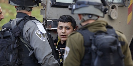 Israeli border policemen arrest a young Palestinian during clashes following a protest to killed a Palestinian militant Basil al-Araj by Israeli forces early Monday, in front of the Israeli Ofer prison, near the West Bank city of Ramallah,, Tuesday, March 7, 2017.(AP Photo/Majdi Mohammed)??