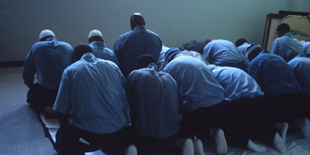 VIRGINIA - CIRCA 2002: Muslim prisoners hold a Friday afternoon prayer in 2002 in a Virginia state prison. (Photo by Andrew Lichtenstein/Corbis via Getty Images)