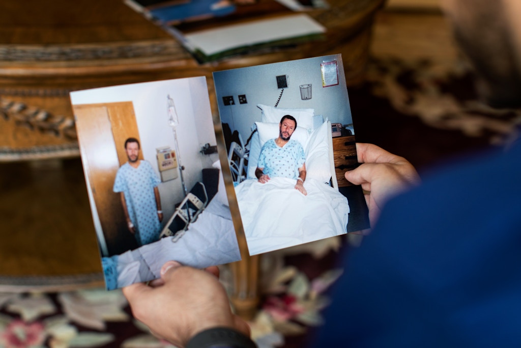 Ahmad Ashqar, 23, holding photos of his father Abdelhaleem Ashqar taken while he was on hunger strike serving a 4015 days sentence in prison. Abdelhaleem Ashqar recently served 11 years in prison for refusing to testify to a grand jury investigating the Palestinian militant group Hamas.