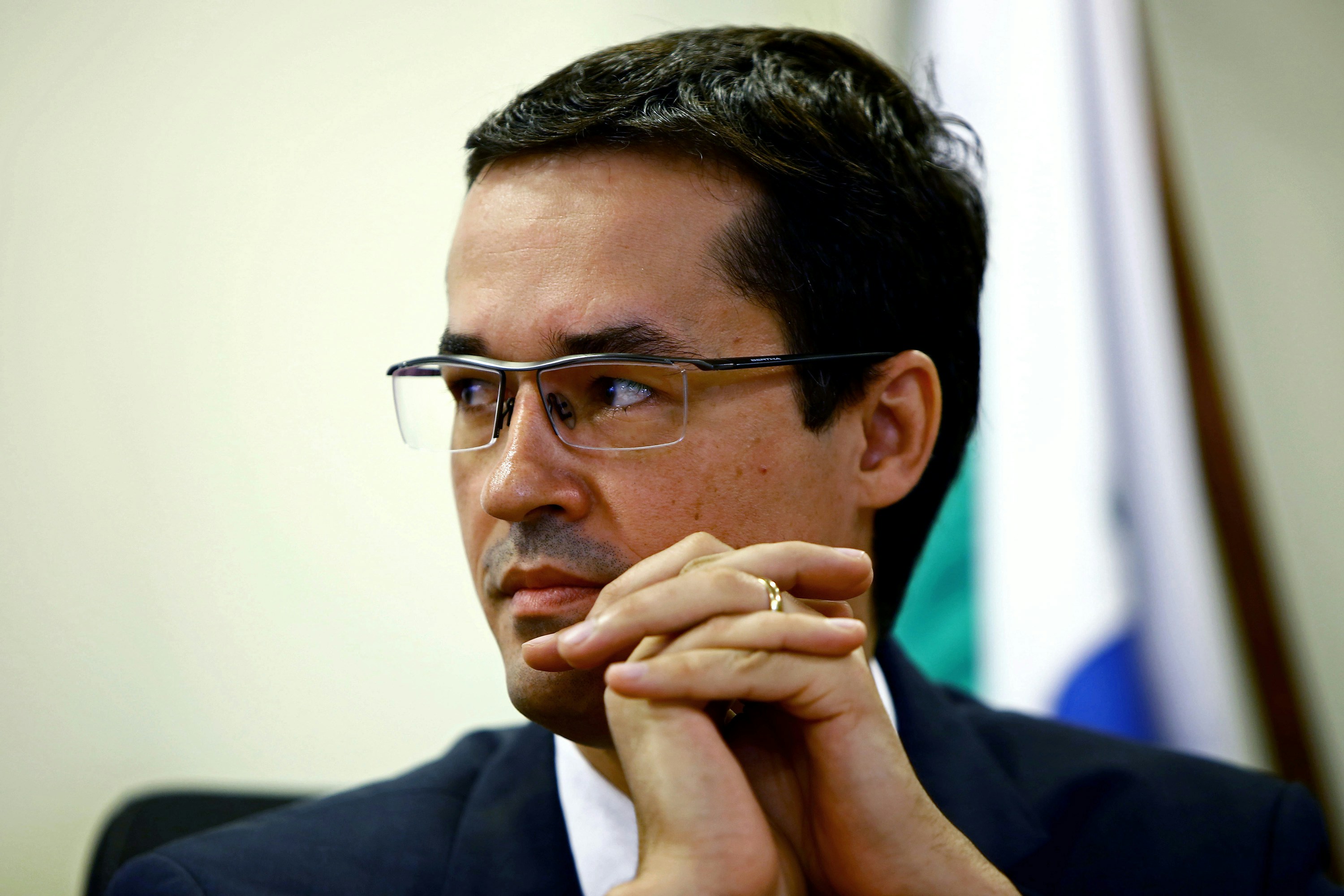 Brazilian Federal Attorney Deltan Dallagnol listens, during the ceremony for the return of resources to Petrobras, which were recovered through cooperation and leniency agreements  in connection with Lava Jato operation, in Curitiba, Brazil on December 07, 2017.  Petrobras received 654 million reais (200 million dollars) from legal agreements related to Lava Jato operation, the largest corruption investigation in Brazil's history, the state-owned company reported. / AFP PHOTO / Heuler Andrey        (Photo credit should read HEULER ANDREY/AFP/Getty Images)