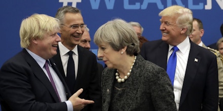 Britain's Foreign Secretary Boris Johnson, left, greets U.S. President Donald Trump, right, a working dinner meeting at the NATO headquarters during a NATO summit of heads of state and government in Brussels on Thursday, May 25, 2017. US President Donald Trump inaugurated the new headquarters during a ceremony on Thursday with other heads of state and government. (AP Photo/Matt Dunham, Pool)