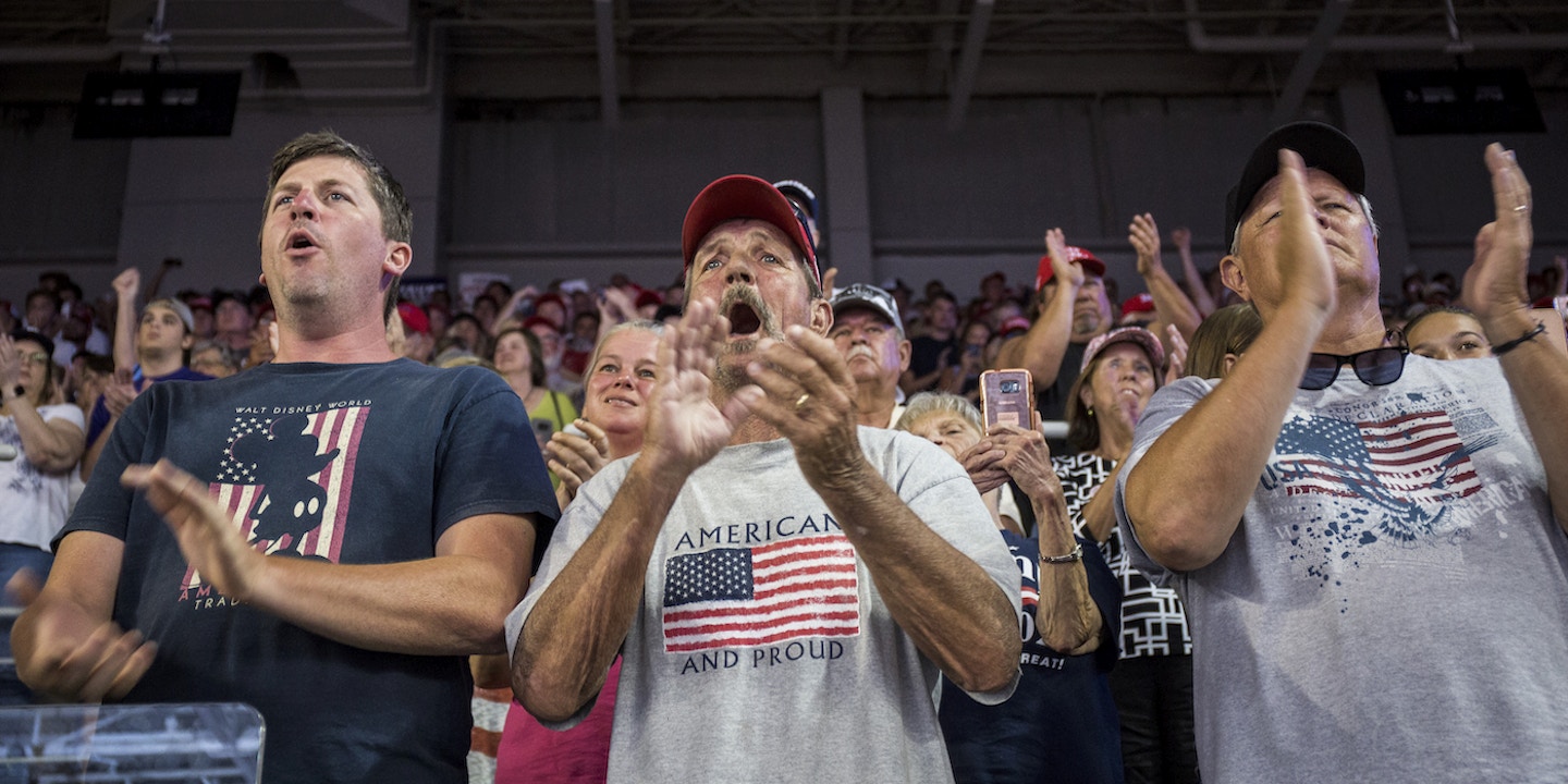 GREENVILLE, NC - JULY 17: Supporters of President Donald Trump applaud during a Keep America Great rally on July 17, 2019 in Greenville, North Carolina. Trump is speaking in North Carolina only hours after The House of Representatives voted down an effort from a Texas Democrat to impeach the President. (Photo by Zach Gibson/Getty Images)