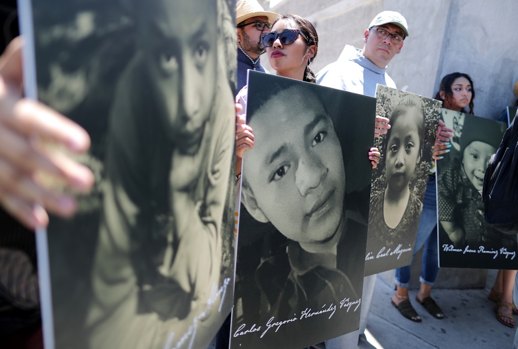 CIUDAD JUAREZ, MEXICO - JUNE 27: Activists hold photos of migrant children who died trying to cross the U.S.-Mexico border on June 27, 2019, in Ciudad Juarez, Mexico. El Paso Bishop Mark Seitz and clergy from the Diocese of Ciudad Juarez held a prayer with migrants who were recently returned to Ciudad Juarez from El Paso because of the controversial 'Remain in Mexico' policy. (Photo by Mario Tama/Getty Images)