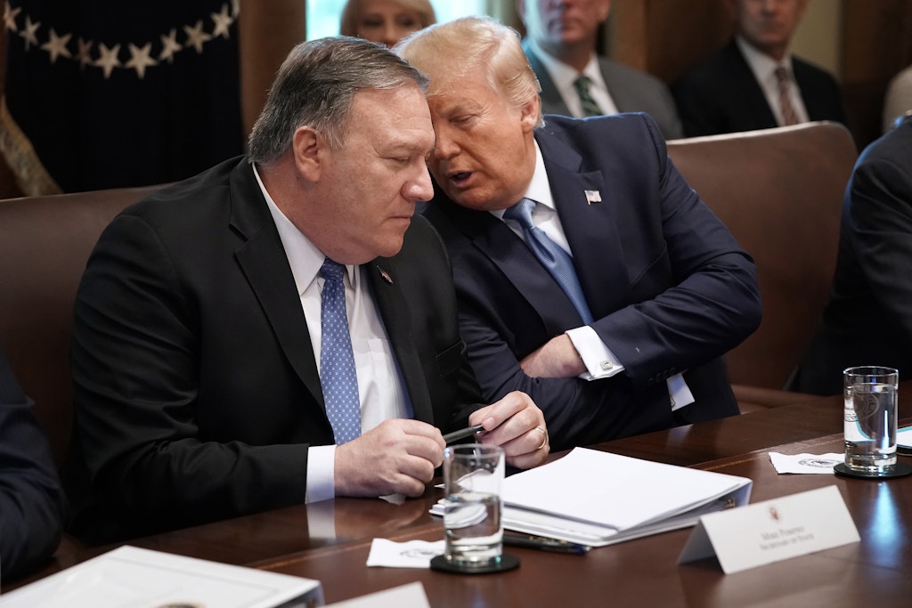 WASHINGTON, DC - JULY 16: U.S. President Donald Trump (R) talks with Secretary of State Mike Pompeo during a cabinet meeting at the White House July 16, 2019 in Washington, DC. Trump and members of his administration addressed a wide variety of subjects, including Iran, opportunity zones, drug prices, HIV/AIDS, immigration and other subjects for more than an hour. (Photo by Chip Somodevilla/Getty Images)