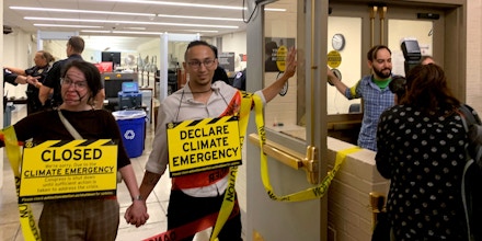 Members of Extinction Rebellion's Washington, D.C., chapter superglued themselves to each other and to passages connecting the Capitol to the Rayburn and Cannon House office buildings on July 23, 2019.