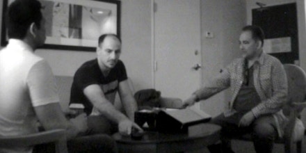 Footage from an FBI hidden camera in a Las Vegas hotel room on April 27, 2015, where Emile Bouari met with FBI agent Dennis Lao and informant Michel Benamar as part of an undercover sting.