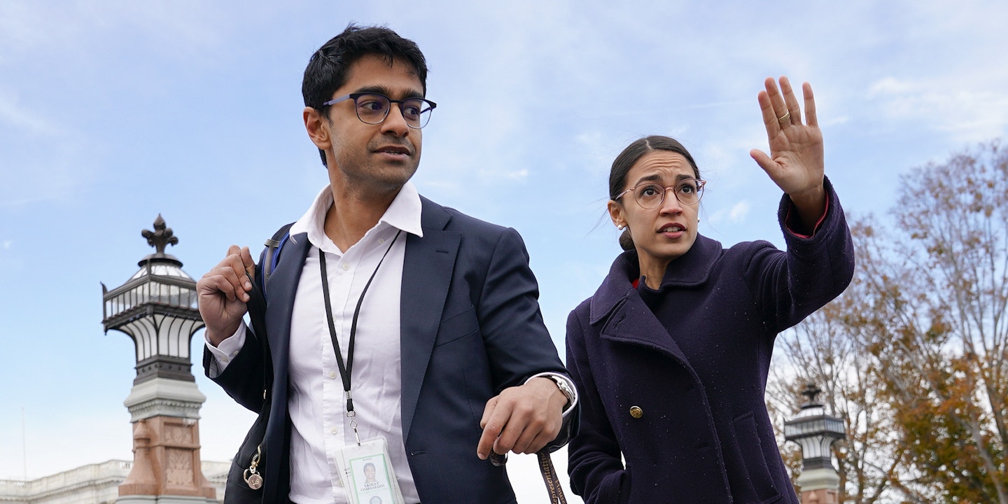 Rep.-elect Alexandria Ocasio-Cortez, D-NY., right, and her chief of staff Saikat Chakrabarti, left, walk back together after joining other members of the freshman class of Congress for a group photo on Capitol Hill in Washington, Wednesday, Nov. 14, 2018. (AP Photo/Pablo Martinez Monsivais)