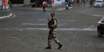 An Indian paramilitary soldier guards during security lockdown in Jammu, India, Monday, Aug. 5, 2019. India's government revoked disputed Kashmir's special status by presidential order Monday as thousands of newly deployed troops descended and some internet and phone services were suspended in the restive Himalayan region where most people oppose Indian rule. (AP Photo/Channi Anand)