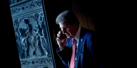 Senator Joe Manchin III (D-WV) speaks on the phone before a meeting with Senate Democrats on Capitol Hill while the US government is shutdown January 22, 2018 in Washington, DC. / AFP PHOTO / Brendan Smialowski        (Photo credit should read BRENDAN SMIALOWSKI/AFP/Getty Images)