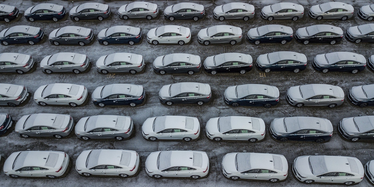 FILE - In this Dec. 5, 2018 file photo, hundreds of Chevrolet Cruze cars sit in a parking lot at General Motors' assembly plant in Lordstown, Ohio. A potential deal to sell the shuttered General Motors plant is still leaving the factory with an uncertain future. In May 2019, GM confirmed that it’s negotiating the sale of the massive assembly plant. (Andrew Rush/Pittsburgh Post-Gazette via AP, File)