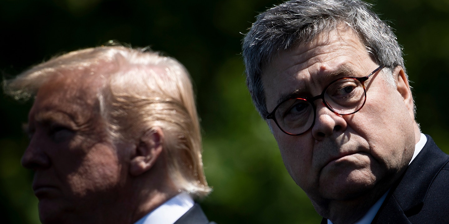US President Donald Trump (L) and US Attorney General William Barr listen during the 38th Annual National Peace OfficersÕ Memorial Service on Capitol Hill May 15, 2019, in Washington, DC. (Photo by Brendan Smialowski / AFP) (Photo credit should read BRENDAN SMIALOWSKI/AFP/Getty Images)