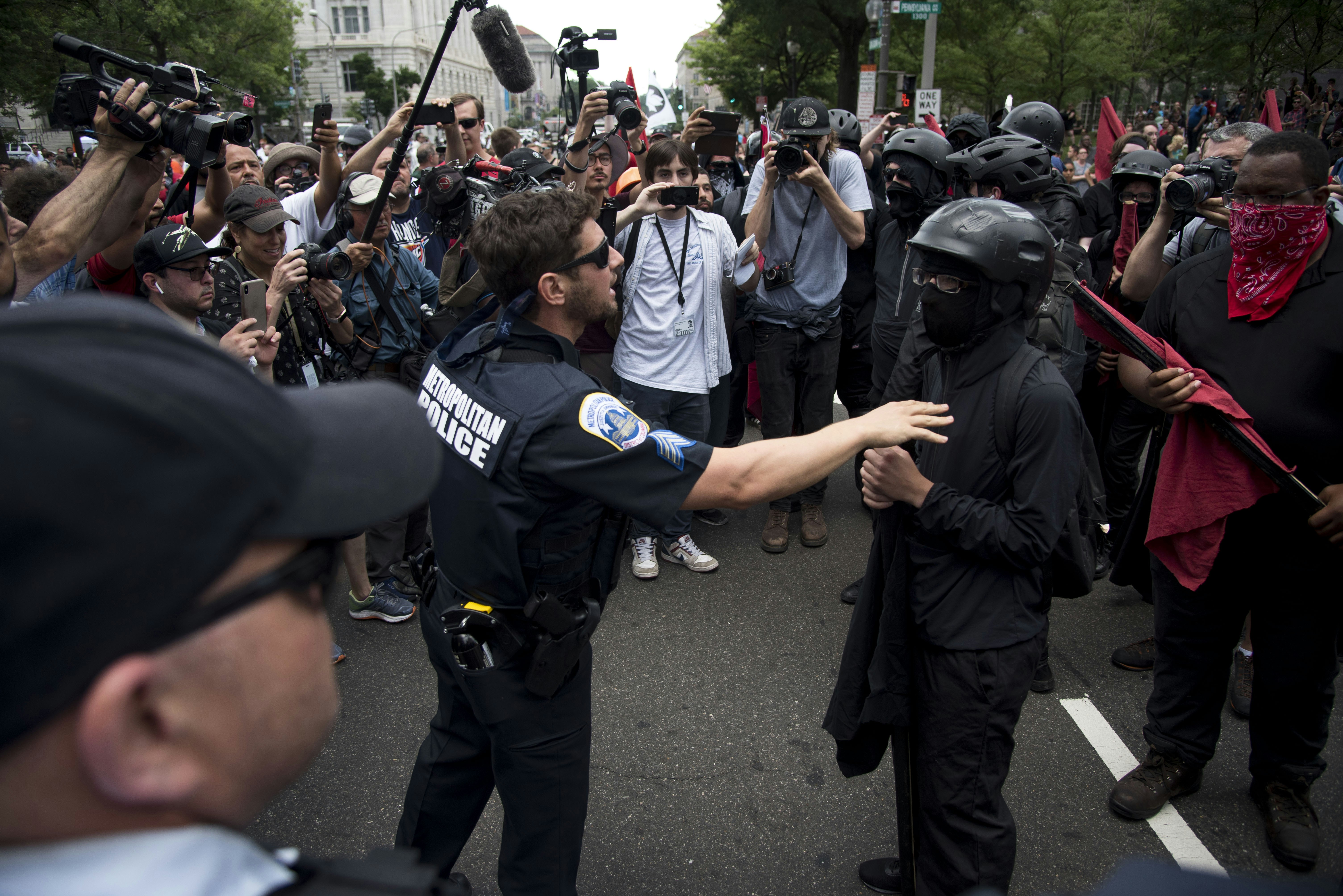 WASHINGTON, DC - JULY 6:  Police officer D.M. Thau talks to a member of Antifa after an Antifa clash with a Trump supporter outside Freedom Plaza during a Proud Boys rally and an All Out D.C. rally on July 6, 2019 in Washington, DC. (Photo by Marlena Sloss/The Washington Post via Getty Images)