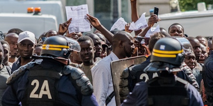 Hundreds of undocumented migrants calling themselves black vests  (gilets noirs) stormed the Pantheon monument in central Paris on July 12, 2019 demanding the right to remain in France. (Photo by Estelle Ruiz/NurPhoto via Getty Images)