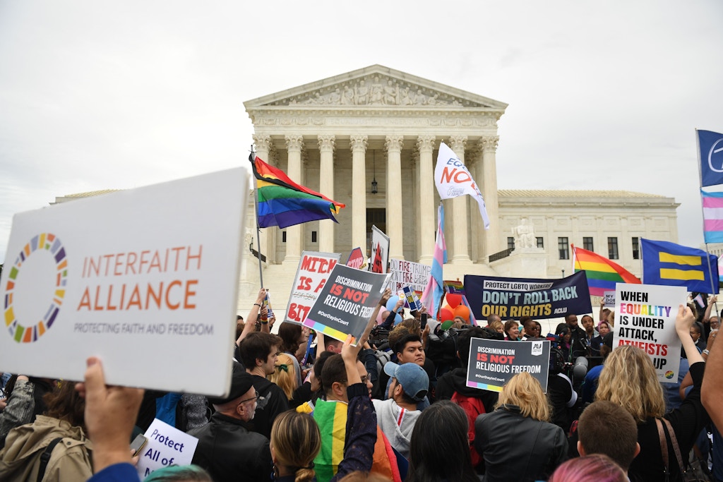 Demonstrators in favor of LGBT rights rally outside the US Supreme Court in Washington, DC, October 8, 2019, as the Court holds oral arguments in three cases dealing with workplace discrimination based on sexual orientation. (Photo by SAUL LOEB / AFP) (Photo by SAUL LOEB/AFP via Getty Images)