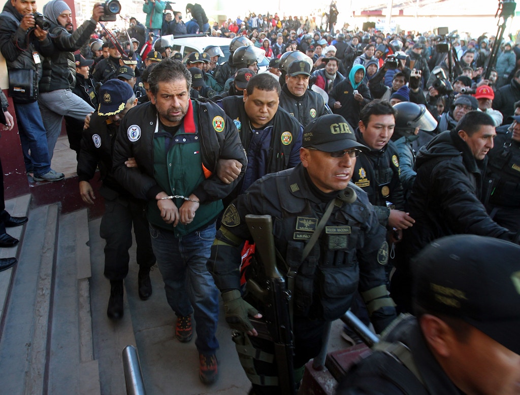 Mandatory Credit: Photo by Martin Alipaz/EPA/Shutterstock (8105838e) Peruvian Police Escort Peruvian Businessman Martin Belaunde Lossio (4-l) After Being Delivered by Bolivian Authorities to Desaguadero on the Border Between Bolivia and Peru 29 May 2015 Belaunde Lossio was Arrested in the Bolivian Region of Amazonia Four Days After His Escape From House Arrest in La Paz Lossio Faces Corruption Charges in Peru Bolivia Desaguadero Bolivia Peru Corruption - May 2015