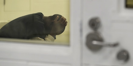 A detainee waits in a holding area during a media tour at the U.S. Immigration and Customs Enforcement (ICE) detention facility Tuesday, Sept. 10, 2019, in Tacoma, Wash. (AP Photo/Ted S. Warren)