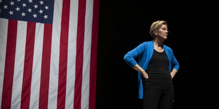 Senator Elizabeth Warren, a Democrat from Massachusetts and 2020 presidential candidate, stands on stage during a campaign event at Iowa State University in Ames, Iowa, U.S., on Monday, Oct. 21, 2019. Warren unveiled an $800 billion plan to fund her progressive proposal for reshaping U.S. public education and disclosed that her signature wealth tax will pay for school and child-care initiatives -- in effect transferring the cost of raising a child from birth to college to America's richest families. Photographer: Daniel Acker/ Bloomberg