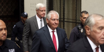 Rex Tillerson, former chief executive officer of Exxon Mobil Corp., center, departs from state court in New York, U.S., on Wednesday, Oct. 30, 2019. Tillerson testified Wednesday in New York's securities-fraud trial over the oil giant's climate-change disclosures, adding an element of drama to proceedings that have had few fireworks so far. Photographer: Peter Foley/Bloomberg via Getty Images