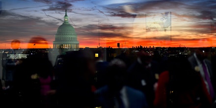 WASHINGTON, DC - NOVEMBER 13: Congressional staff are reflected as the sun sets behind the U.S. Capitol Building on November 13, 2019 in Washington, DC. In the first public impeachment hearings in more than two decades, House Democrats are trying to build a case that President Donald Trump committed extortion, bribery or coercion by trying to enlist Ukraine to investigate his political rival in exchange for military aide and a White House meeting that Ukraine President Volodymyr Zelensky sought with Trump. (Photo by Mark Makela/Getty Images)