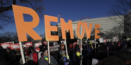 WASHINGTON, DC - DECEMBER 18: Protesters supporting the impeachment of U.S. President Donald Trump gather outside the U.S. Capitol December 18, 2019 in Washington, DC. Later today the U.S. House of Representatives is expected to vote on two articles of impeachment against Trump charging him with abuse of power and obstruction of Congress. (Photo by Win McNamee/Getty Images)