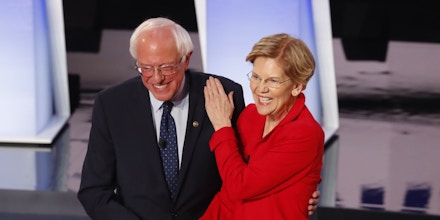 Sen. Bernie Sanders, I-Vt., and Sen. Elizabeth Warren, D-Mass., greet each other before the first of two Democratic presidential primary debates hosted by CNN Tuesday, July 30, 2019, in the Fox Theatre in Detroit. (AP Photo/Paul Sancya)