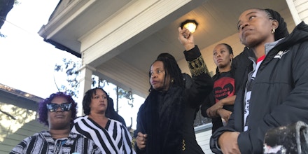 In this photo taken Dec. 30, 2019, Sharena Thomas, left, Carroll Fife, center, Dominique Walker, second from right, and Tolani KIng, right, stand outside a vacant home on Magnolia Street in West Oakland, Calif. The group Moms 4 Housing is fighting an eviction after occupying the house since November. The women took over the home after they said they were unable to find permanent housing in the Bay Area, where high-paying tech jobs have exacerbated income inequality and a housing shortage. (Kate Wolffe/KQED via AP)