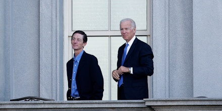 Vice President Joe Biden, right, and his Chief of Staff Bruce Reed, left, talk on a balcony of the Old Executive Office building on the White House complex in Washington, Monday, Oct. 14, 2013. (AP Photo/Pablo Martinez Monsivais)