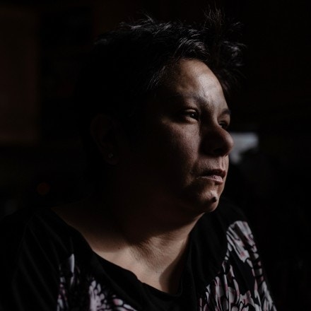 Angela Ramirez looks out the window of her home in Waukegan, Ill. on Jan. 2, 2020. Ramirez, who was diagnosed with breast cancer, lives less than six miles away from two factories that emit ethylene oxide, a gas known to cause cancer. Pat Nabong for The Intercept.