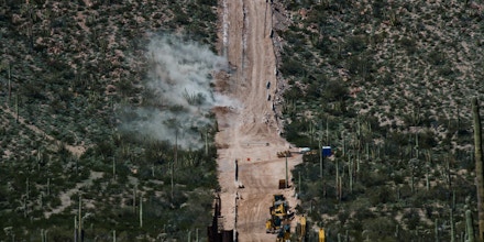 LUKEVILLE, AZ - FEBRUARY 26: More than 80 small explosives eject debris and smoke into the desert as CBP and contracted prepare for further border wall replacement and construction on February 26 in Lukeville, Arizona. Monument Hill and Quitobaquito Springs located along the border in the Organ Pipe Cactus National Monument are sacred to Tohono, Hia-Ced and Akmiel O’odham and the national monument also holds Apache burial sites. (Ash Ponders for The Intercept)