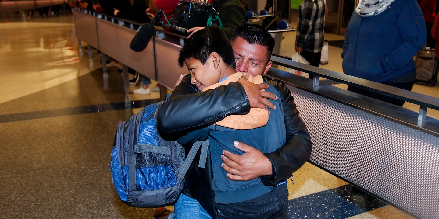 David Xol-Cholom, of Guatemala hugs his son Byron at Los Angeles International Airport as they reunite after being separated about one and half year ago during the Trump administration's wide-scale separation of immigrant families, Wednesday, Jan. 22, 2020, in Los Angeles. (AP Photo/Ringo H.W. Chiu)