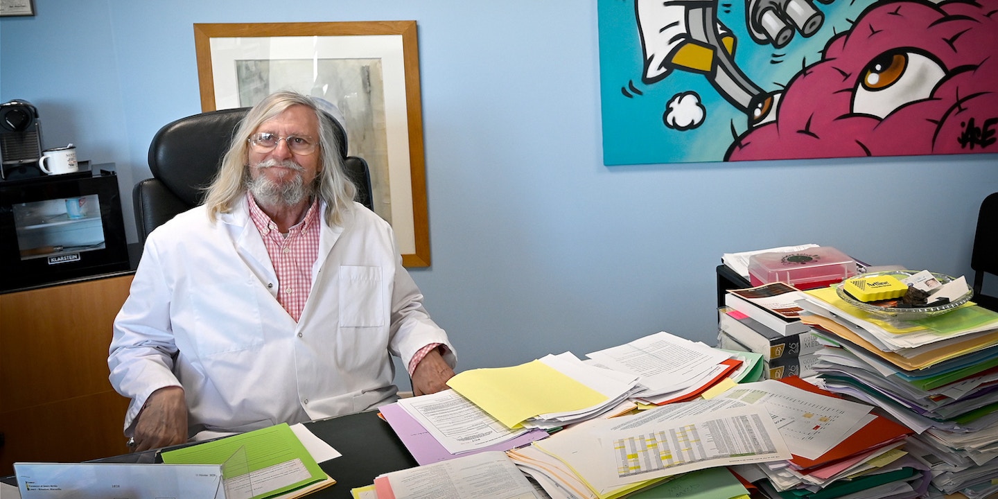A picture taken on February 26, 2020 shows French professor Didier Raoult, biologist and professor of microbiology, specialized in infectious diseases and director of IHU Mediterranee Infection Institute posing in his office in Marseille, southeastern France. - Raoult reported this week that after treating 24 patients for six days with Plaquenil, the virus had disappeared in all but a quarter of them. The research has not yet been peer reviewed or published, and Raoult had come under fire by some scientists and officials in his native France for potentially raising false hopes. (Photo by GERARD JULIEN / AFP) (Photo by GERARD JULIEN/AFP via Getty Images)