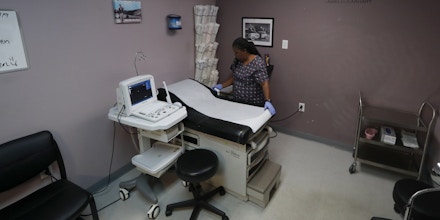 Director of Clinical Services, Marva Sadler, prepares the operating room at the Whole Woman's Health clinic in Fort Worth, Texas, Wednesday, Sept. 4, 2019. (AP Photo/Tony Gutierrez)