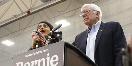 Democratic presidential candidate Sen. Bernie Sanders I-Vt., has his remarks interrupted by a protestor, left, during his campaign event in Carson City, Nev.., Sunday, Feb. 16, 2020. (AP Photo/Rich Pedroncelli)