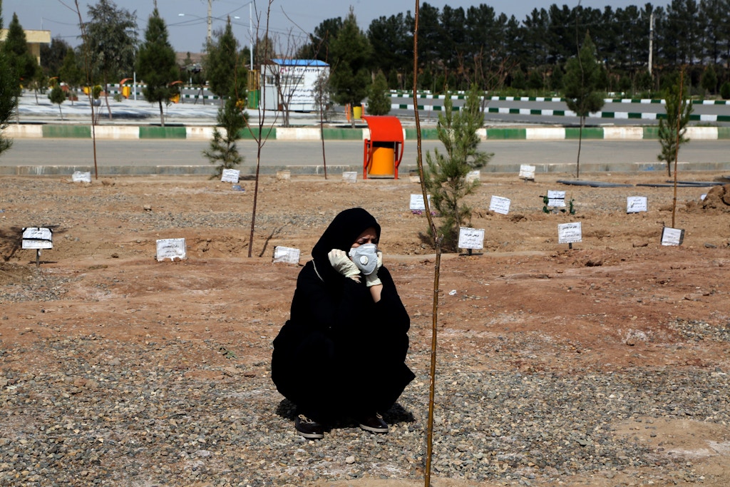 A woman mourns during a funeral held at Beheshte Masoumeh Cemetery for the victims of the new coronavirus in Qom, Iran, on March 17, 2020. 