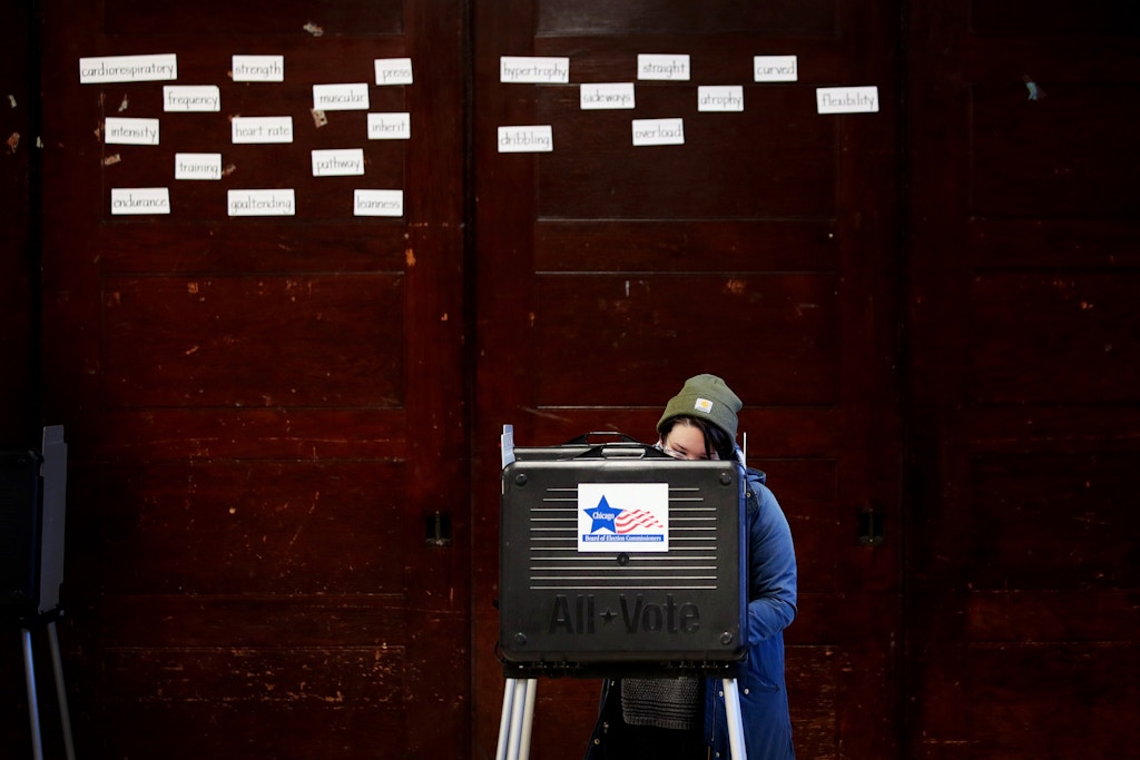 CHICAGO, ILLINOIS - MARCH 17: A voter casts a ballot in the primary election at Columbus Grade School on March 17, 2020 in Chicago, Illinois. Illinois, Ohio Arizona and Florida were scheduled to hold elections today but Ohio cancelled citing a health emergency posed by COVID-19.  (Photo by Scott Olson/Getty Images)