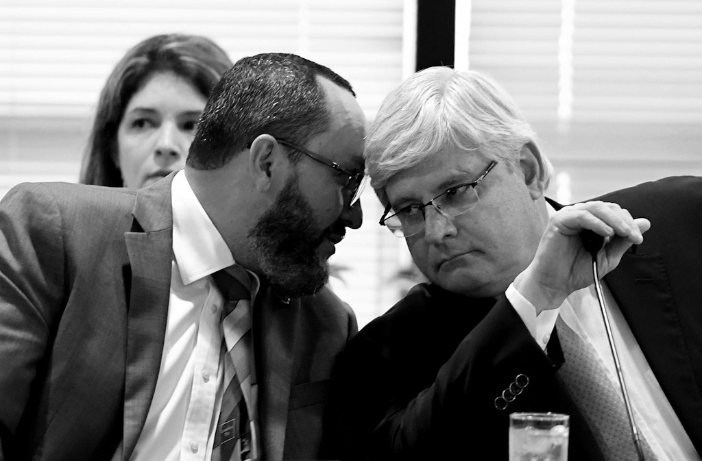 Brazil's Attorney General Rodrigo Janot(R) listens to Attorney General Office' Secretary of International Cooperation Vladimir Aras during a meeting with ten Latin American countries at the Attorney General's Office in Brasilia, on February 16, 2017.  Prosecutors from countries caught up in the gigantic bribery scandal at Brazilian construction conglomerate Odebrecht hold a conference.  / AFP / EVARISTO SA        (Photo credit should read EVARISTO SA/AFP via Getty Images)